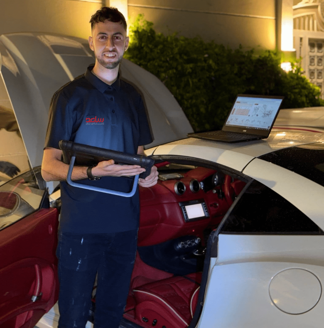 Saaed service programmer doing ECU programming for white ferrari.